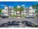 Inviting condo building with palms, multiple levels, ample parking, and a manicured landscape at 116 Cypress Point Ct. # 302, Myrtle Beach, SC 29579