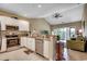 A modern kitchen with granite countertops, stainless steel appliances, and an open view of the living room at 116 Cypress Point Ct. # 302, Myrtle Beach, SC 29579