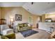 Spacious living room with neutral colors, a cozy seating area, and a view of the kitchen at 116 Cypress Point Ct. # 302, Myrtle Beach, SC 29579