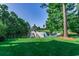 Picturesque view of a serene pond with a gazebo and lush green surroundings creating a peaceful setting at 116 Cypress Point Ct. # 302, Myrtle Beach, SC 29579