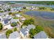 Scenic aerial view of a home in a coastal community, surrounded by marsh and waterways at 118 Seaside St., Holden Beach, NC 28462