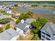 Aerial view of a coastal home near the marsh, combining natural beauty with residential charm at 118 Seaside St., Holden Beach, NC 28462