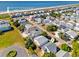 Stunning aerial view showcasing the proximity to the beach and the surrounding neighborhood at 118 Seaside St., Holden Beach, NC 28462