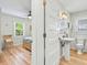 View through doorway of bedroom and bathroom with pedestal sink at 118 Seaside St., Holden Beach, NC 28462