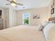 Bedroom with window, light walls, closet, and wood-look flooring at 118 Seaside St., Holden Beach, NC 28462