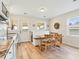 Eat in dining area featuring wood floors, white trim and a view to the outside at 118 Seaside St., Holden Beach, NC 28462