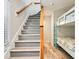 Hallway view with stairs and a bunk bed room with light-wood flooring at 118 Seaside St., Holden Beach, NC 28462