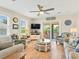 Inviting living room featuring stylish furnishings, a ceiling fan, and sliding glass doors at 118 Seaside St., Holden Beach, NC 28462