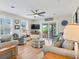 Comfortable living room with stylish decor, a ceiling fan, and access to a covered deck at 118 Seaside St., Holden Beach, NC 28462