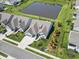 Aerial view of neighborhood featuring pond, lush landscaping, and manicured lawns at 1211 Arezzo Ave., Myrtle Beach, SC 29572