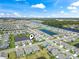 Aerial view showing a planned community with a pond and the ocean in the distance at 1211 Arezzo Ave., Myrtle Beach, SC 29572