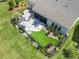 Aerial view of backyard including the patio, seating, turf, and beautiful landscaping at 1211 Arezzo Ave., Myrtle Beach, SC 29572