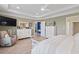 Light-filled bedroom with neutral walls, hardwood floors, and an en-suite bathroom at 1211 Arezzo Ave., Myrtle Beach, SC 29572