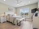 Bright bedroom with a queen bed, ceiling fan, and view of the neighborhood at 1211 Arezzo Ave., Myrtle Beach, SC 29572