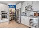 Modern kitchen featuring a pantry, stainless steel appliances, wine rack, and wine refrigerator at 1211 Arezzo Ave., Myrtle Beach, SC 29572