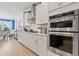 Bright kitchen with stainless steel appliances, ample cabinet space, and hardwood floors at 1211 Arezzo Ave., Myrtle Beach, SC 29572