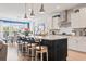 Modern kitchen with a large island, pendant lighting, breakfast bar, and stainless steel appliances at 1211 Arezzo Ave., Myrtle Beach, SC 29572