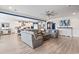 Spacious open-concept living room with a view of the modern kitchen and neutral colored furniture at 1211 Arezzo Ave., Myrtle Beach, SC 29572