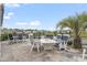 Spacious outdoor patio with ample seating and a charming outdoor fire pit, with a view of the pond at 1211 Arezzo Ave., Myrtle Beach, SC 29572
