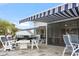 Outdoor patio with awning, grill, fire pit, and several seating options at 1211 Arezzo Ave., Myrtle Beach, SC 29572