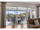 View of the patio seating area and lawn from the living room, through sliding glass doors at 1211 Arezzo Ave., Myrtle Beach, SC 29572