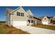 Beautiful two-story home featuring an attached two-car garage, driveway and charming curb appeal at 1231 Barrington Way, Conway, SC 29526