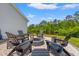 Cozy backyard fire pit area with Adirondack chairs, perfect for relaxing and enjoying the outdoors at 127 Emerald Rush Ct., Longs, SC 29568