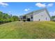 Spacious backyard featuring a well-maintained lawn and scenic views of the surrounding landscape at 127 Emerald Rush Ct., Longs, SC 29568