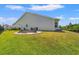 Lush backyard with a fire pit area and views of the water, perfect for outdoor enjoyment at 127 Emerald Rush Ct., Longs, SC 29568