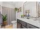 Well-lit bathroom featuring a modern vanity, framed mirrors, and neutral decor at 127 Emerald Rush Ct., Longs, SC 29568