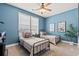 Charming ' bedroom with twin beds, ceiling fan, and bright natural light at 127 Emerald Rush Ct., Longs, SC 29568