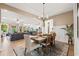Open-concept dining room and kitchen seamlessly connected to the living space at 127 Emerald Rush Ct., Longs, SC 29568