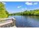 Scenic view of a lake or river from a wooden dock or pier with bench, perfect for enjoying the waterfront at 127 Emerald Rush Ct., Longs, SC 29568