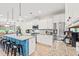 Modern kitchen featuring stainless steel appliances, granite countertops, and a blue island at 127 Emerald Rush Ct., Longs, SC 29568