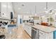 Spacious kitchen featuring stainless steel appliances, white cabinets, and a kitchen island at 127 Emerald Rush Ct., Longs, SC 29568