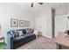 Comfortable living room featuring a plush sofa, accent wall, and stylish décor at 127 Emerald Rush Ct., Longs, SC 29568