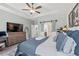 Tranquil main bedroom featuring a tray ceiling, barn door to ensuite, and ample space at 127 Emerald Rush Ct., Longs, SC 29568