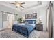 Inviting main bedroom featuring tray ceiling, ensuite access, and elegant furnishings at 127 Emerald Rush Ct., Longs, SC 29568