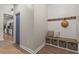 Inviting mudroom with custom bench, storage baskets, and shiplap accent wall at 127 Emerald Rush Ct., Longs, SC 29568