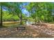Tranquil waterfront view, surrounded by lush trees at 127 Emerald Rush Ct., Longs, SC 29568