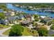 Breathtaking aerial view of a waterfront home with lush landscaping and stunning views of the surrounding waterway at 130 Pier Pointe Dr., Little River, SC 29566