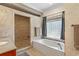 Luxurious bathroom featuring a jacuzzi tub, a tiled shower, and a vanity at 130 Pier Pointe Dr., Little River, SC 29566