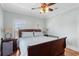 Inviting bedroom featuring a wooden bed, ceiling fan, and serene atmosphere at 130 Pier Pointe Dr., Little River, SC 29566
