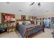 Large bedroom with vaulted ceilings, ceiling fan, and sports memorabilia themed decor at 130 Pier Pointe Dr., Little River, SC 29566
