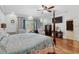 Bright primary bedroom with four-poster bed, chairs, and lots of natural light at 130 Pier Pointe Dr., Little River, SC 29566