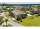 Aerial view of a charming property featuring a spacious yard, mature trees, and architectural design at 130 Pier Pointe Dr., Little River, SC 29566