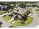Aerial view of a well-manicured property featuring lush landscaping, a charming exterior, and elegant architectural details at 130 Pier Pointe Dr., Little River, SC 29566