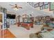 Large game room has vaulted ceilings, sports memorabilia on the wall, and a ceiling fan at 130 Pier Pointe Dr., Little River, SC 29566