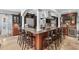 Modern kitchen with extended bar seating, stainless steel appliances, granite counters, and custom cabinets at 130 Pier Pointe Dr., Little River, SC 29566