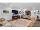 Comfortable living area featuring hardwood floors, wainscoting, and a large flat-screen TV at 130 Pier Pointe Dr., Little River, SC 29566